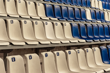 Empty white and blue seats in the stadium