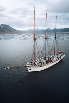 Aerial view of a Sailing Ship with mountains and rivers in the background