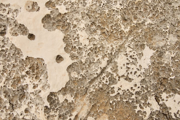 brown color natural marble with royal feel texture. cracks in the rocks on the shore