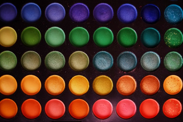 Colorful makeup set of eye shadows background