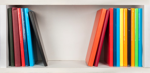 bookshelf - colored books on white shelfs