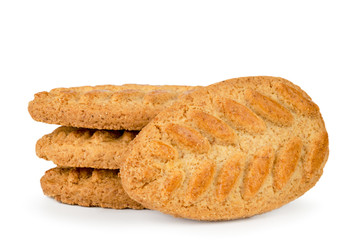 Cookies with wheat spikelets close - up on a white. Isolated.