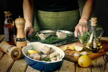 Foto op Canvas fish, cooking fish, Mediterranean cooking, Woman, Restaurant, ho © hannamartysheva