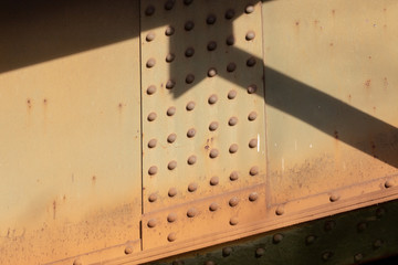 Metal rivets of an old rusty bridge 