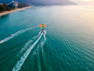 boat and paragliding in the sea