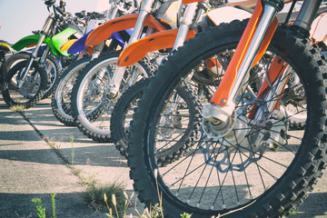 Motocross bike stand in a row