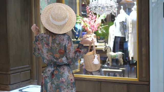 Young Woman Shopping And Looking At Store Window