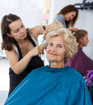 Senior lady getting haircutting