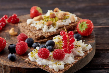 Sandwich with nuts and berrie Useful breakfast.