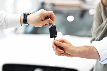 Midsection of young couple buying new car