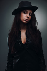 Fototapeta na wymiar Girl in black hat