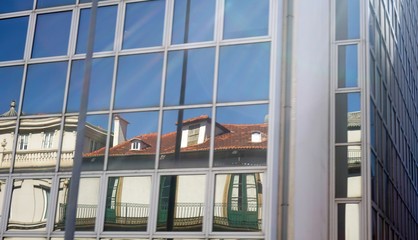 Obraz premium colorful old houses of porto reflected on glass