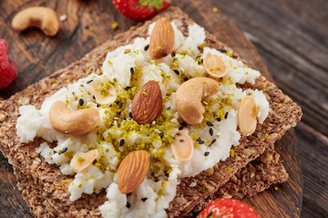 Sandwich with nuts and berrie Useful breakfast.