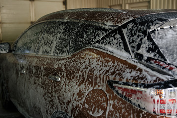 Summer Car Washing. Cleaning Car Using High Pressure Water.