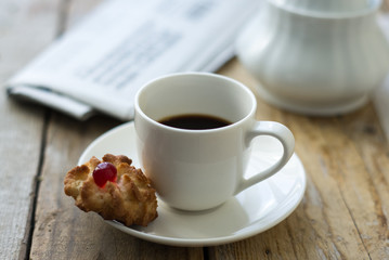 Sweet homemade cookies and cup of coffee on the table, selective focus and copy space