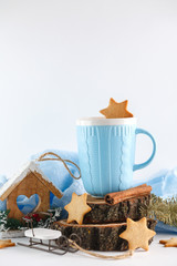 blue mug, ginger cookies and Christmas symbols on white background. New year's composition 2018