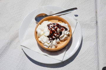 pumpkin mousse and cream with chocolate sauce on white dish