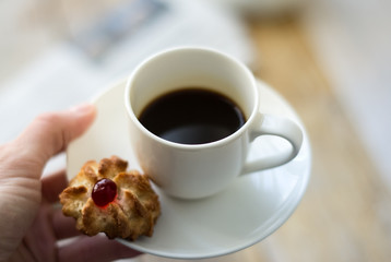 Sweet homemade cookies and cup of coffee on the table, selective focus and copy space
