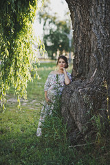 Portrait of a girl at the trunk of a weeping willow 1730.