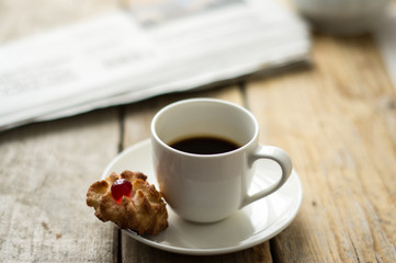 Sweet homemade cookies and cup of coffee on the table, selective focus and copy space