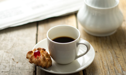 Sweet homemade cookies and cup of coffee on the table, selective focus and copy space