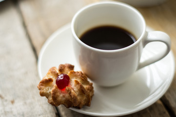 Sweet homemade cookies and cup of coffee on the table, selective focus and copyspace