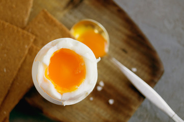 Breakfast. eggs soft-boiled on a gray background.