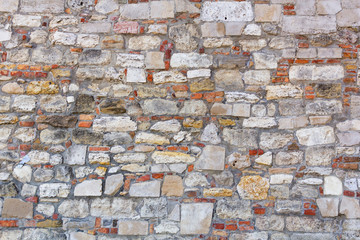 Old cracked stone wall textured background