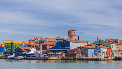 Colorful houses and shipyard over water, on the island of Burano, Venice, Italy
