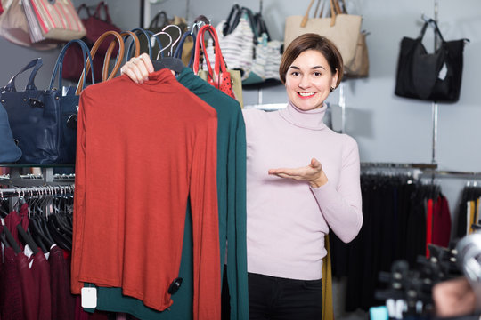 Woman is deciding on turtleneck sweater