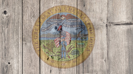 USA Politics News Concept: US State Iowa Seal Wooden Fence Background