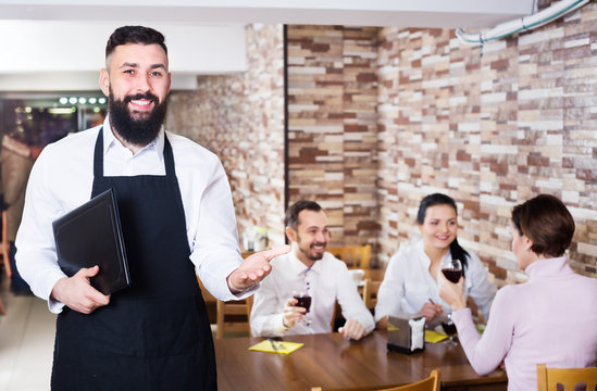 Waiter serving restaurant guests