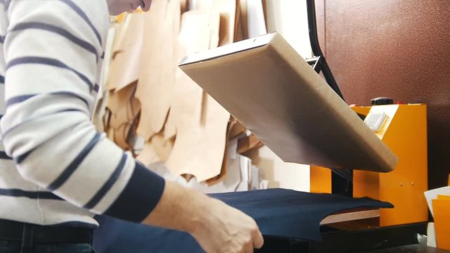 A person preparing t-shirt for printing