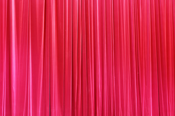 Photo Theatrical curtain of scarlet color of velvet.