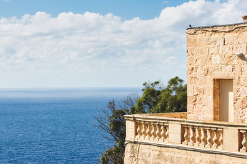 Balcony of a rural villa looking onto the blue Mediterranean sea