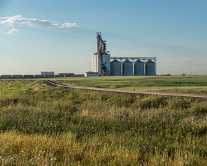 Fototapeta na wymiar Grain Elevator and Train in Alberta