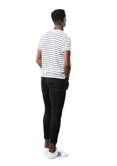 Full body of Dark skinned man with striped shirt looking back on white background
