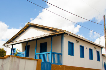 house on a background of blue sky and clouds