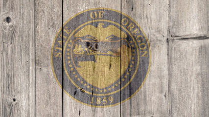 Fototapeta na wymiar USA Politics News Concept: US State Oregon Seal Wooden Fence Background