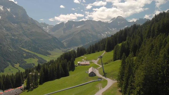 Elm village and Swiss mountains - Piz Segnas, Piz Sardona, Laaxer Stockli from Ampachli, Glarus, Switzerland, Europe.