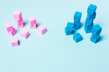 Fototapeta na wymiar Blue and pink cubes. The concept of sexism, feminism and equality