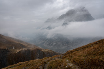 Mountain partly engulfed in clouds