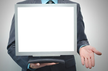 TV computer monitor with blank screen in the businessman hand isolated on white background.