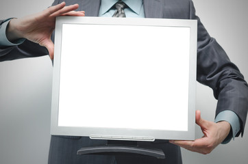 TV computer monitor with blank screen in the businessman hand isolated on white background.