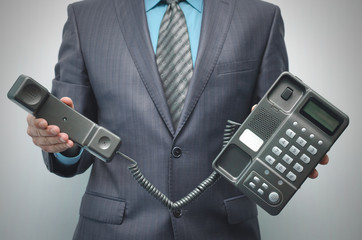 Telephone in the male hand isolated on the white background.