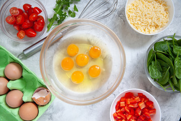 Fresh vegetables, eggs and cheese. Ingredients for healthy breakfast omelet