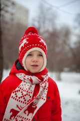 Winter portrait of kid boy in colorful clothes