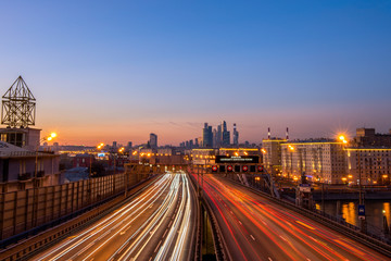 Fototapeta na wymiar Third transport ring in Moscow, sunset view with tracers and traffic, and 
