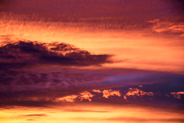 romantic sunset sky with golden clouds