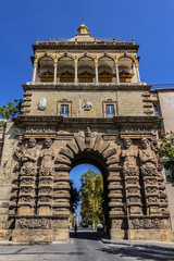 Fototapeta na wymiar Monumental city gate of Palermo - Porta Nuova (1583 - 1669). Porta Nuova is located beside Palazzo dei Normanni (Palermo old royal palace). Palermo, Sicily, Italy.